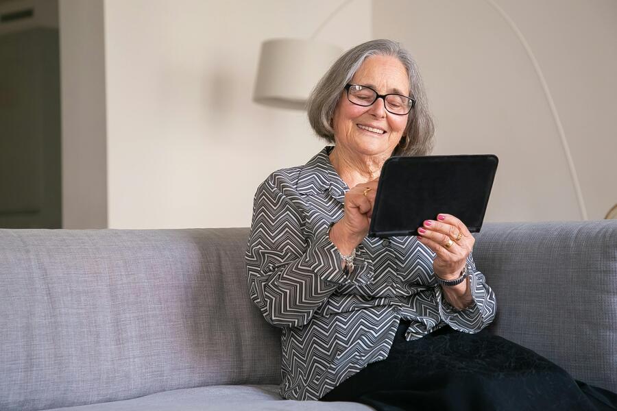 older woman with tablet